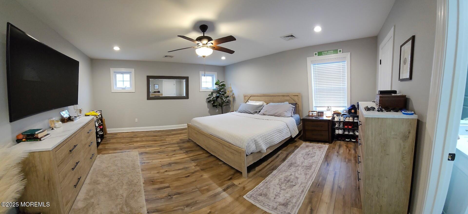 137 Jordan Road Brick, NJ 08724 - Photo 16 of 38 a bedroom with a bed and a flat screen tv