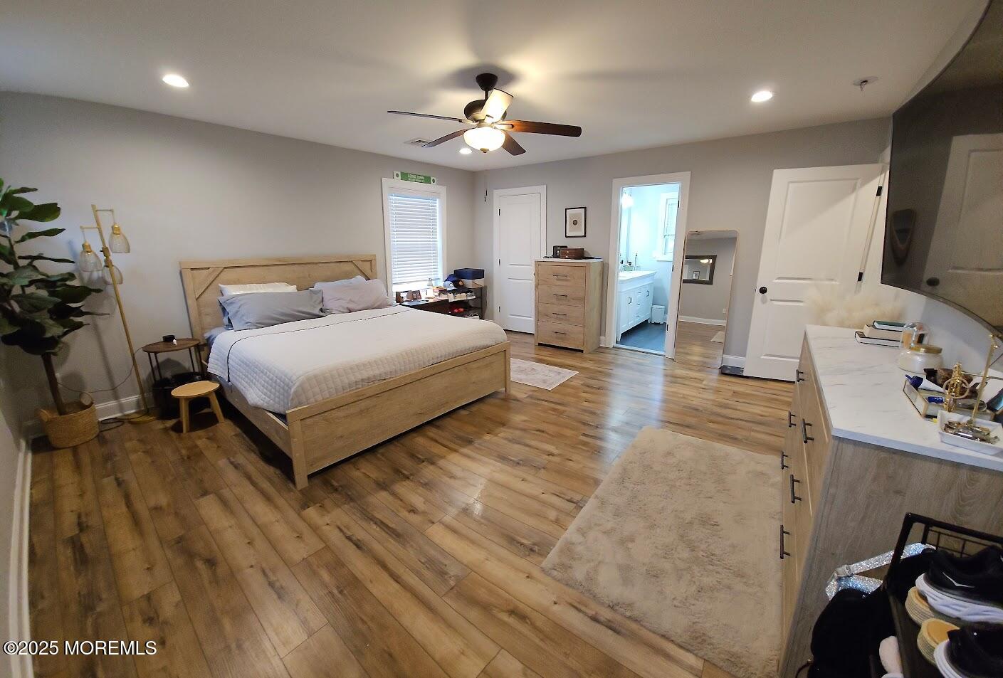 137 Jordan Road Brick, NJ 08724 - Photo 17 of 38 a spacious bedroom with a bed and a large mirror