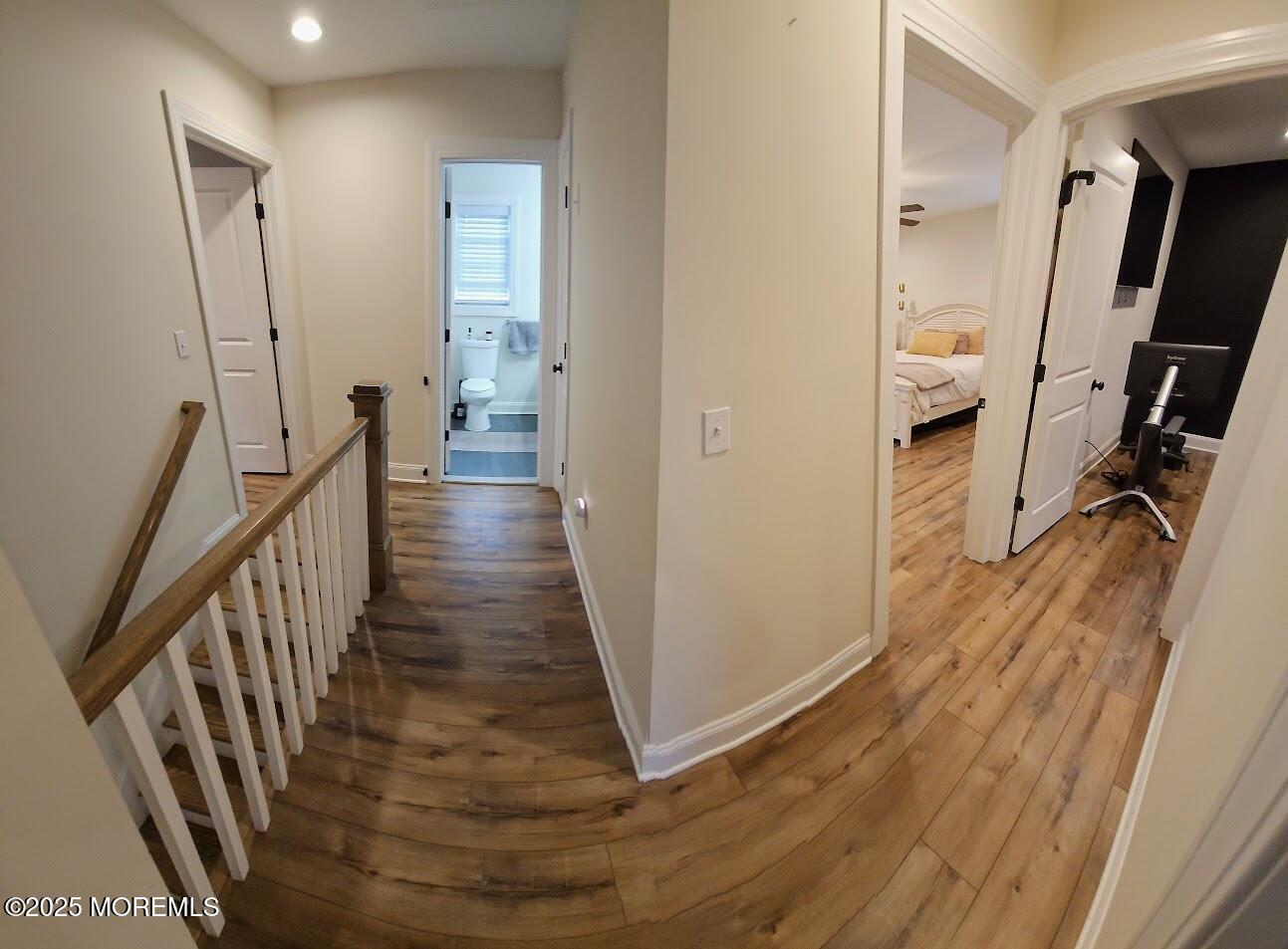 137 Jordan Road Brick, NJ 08724 - Photo 24 of 38 a view of a hallway with wooden floor and stairs