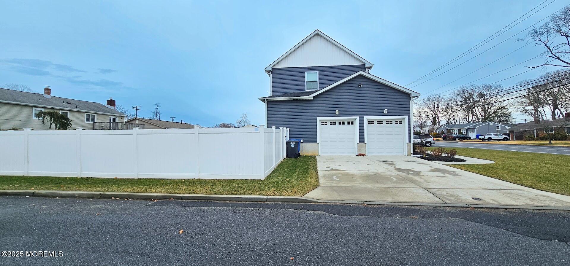 137 Jordan Road Brick, NJ 08724 - Photo 3 of 38 a view of a house with a yard and garage