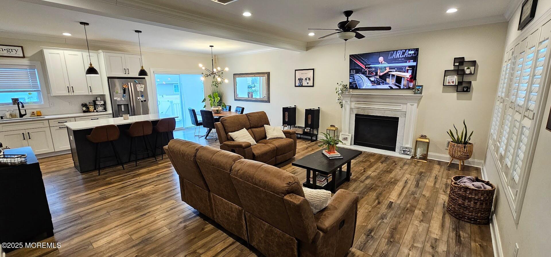 137 Jordan Road Brick, NJ 08724 - Photo 4 of 38 a living room with furniture kitchen view and a fireplace