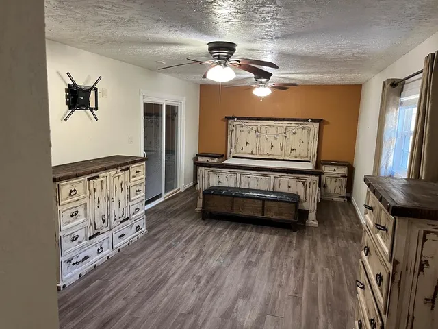 a view of a livingroom with wooden floor