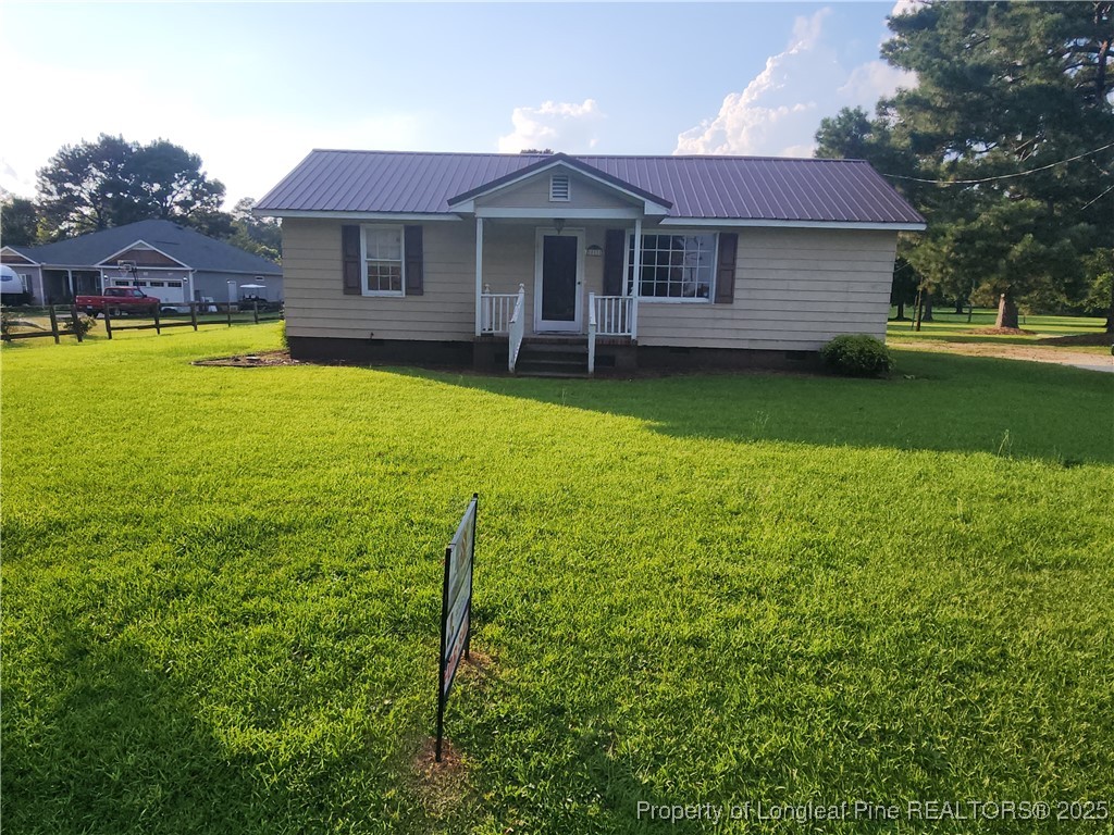 803 Antioch Church Road Dunn, NC 28334 - Photo 1 of 17 a view of a house with a yard balcony and a small yard