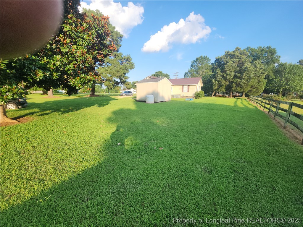 803 Antioch Church Road Dunn, NC 28334 - Photo 16 of 17 a view of a golf course with a lake
