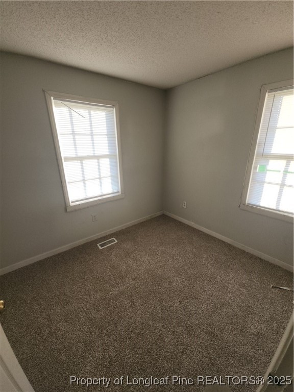 803 Antioch Church Road Dunn, NC 28334 - Photo 7 of 17 an empty room with a window