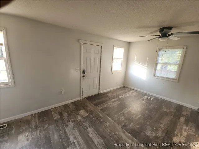 a view of empty room with windows