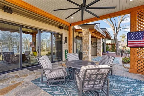 a view of an outside dining space with furniture