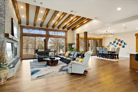 a living room with furniture and large windows