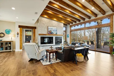 a living room with fireplace furniture and a flat screen tv