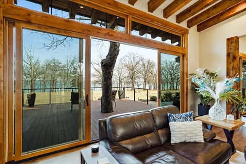 a balcony with furniture and a potted plant