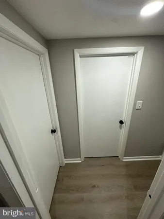 an empty room with wooden floor