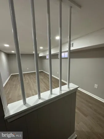 a view of an empty room with glass door