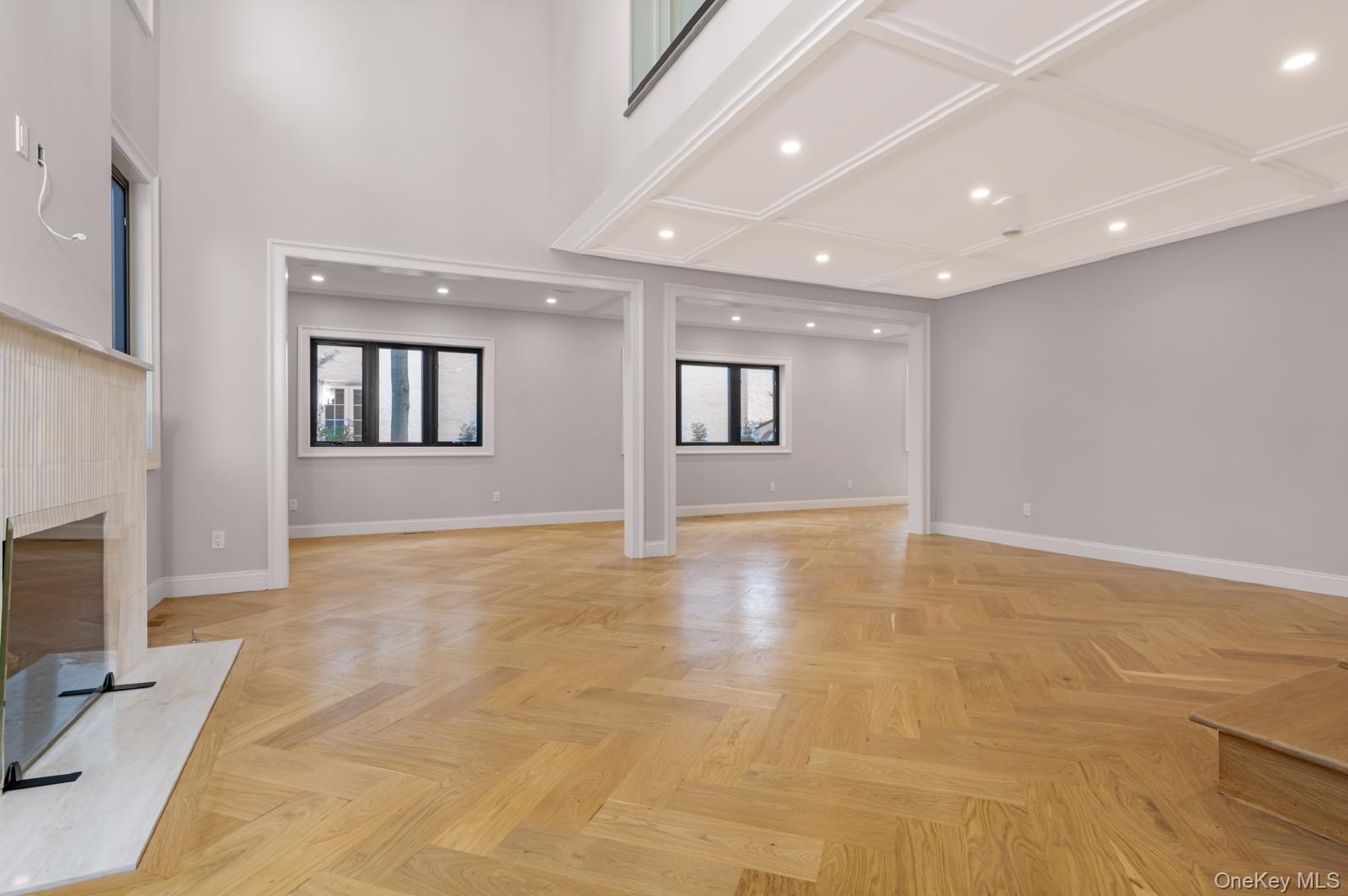 120 Baker Hill Road Great Neck, NY 11023 - Photo 15 of 25 a view of an empty room with a fireplace