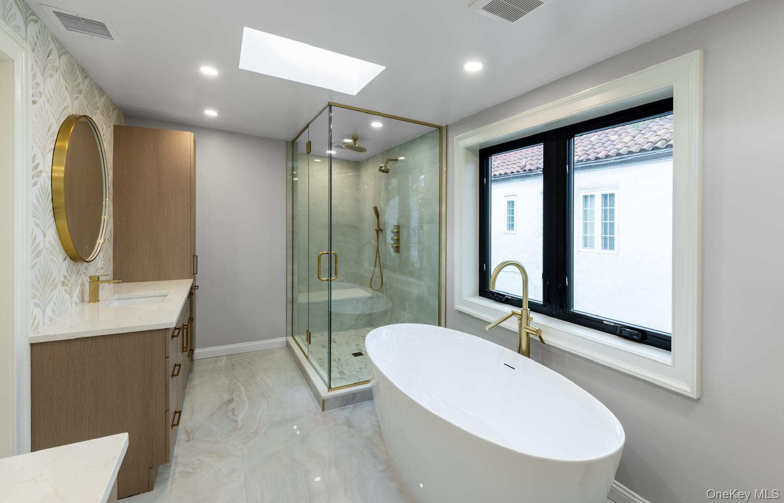 120 Baker Hill Road Great Neck, NY 11023 - Photo 16 of 25 a bathroom with a double vanity sink mirror and bathtub