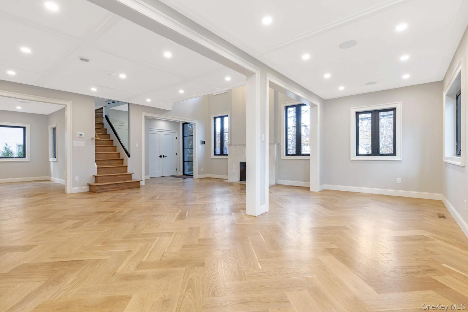120 Baker Hill Road Great Neck, NY 11023 - Photo 18 of 25 a view of an empty room with stairs and stairs