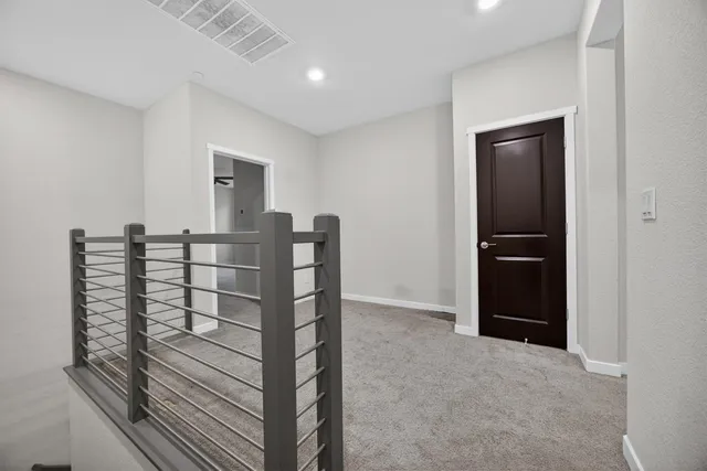 a view of a hallway with seating area