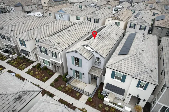 an aerial view of a multi story parking building