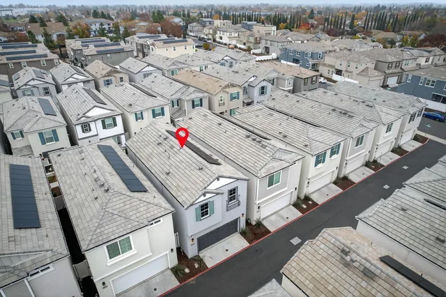 an aerial view of a multi story parking building