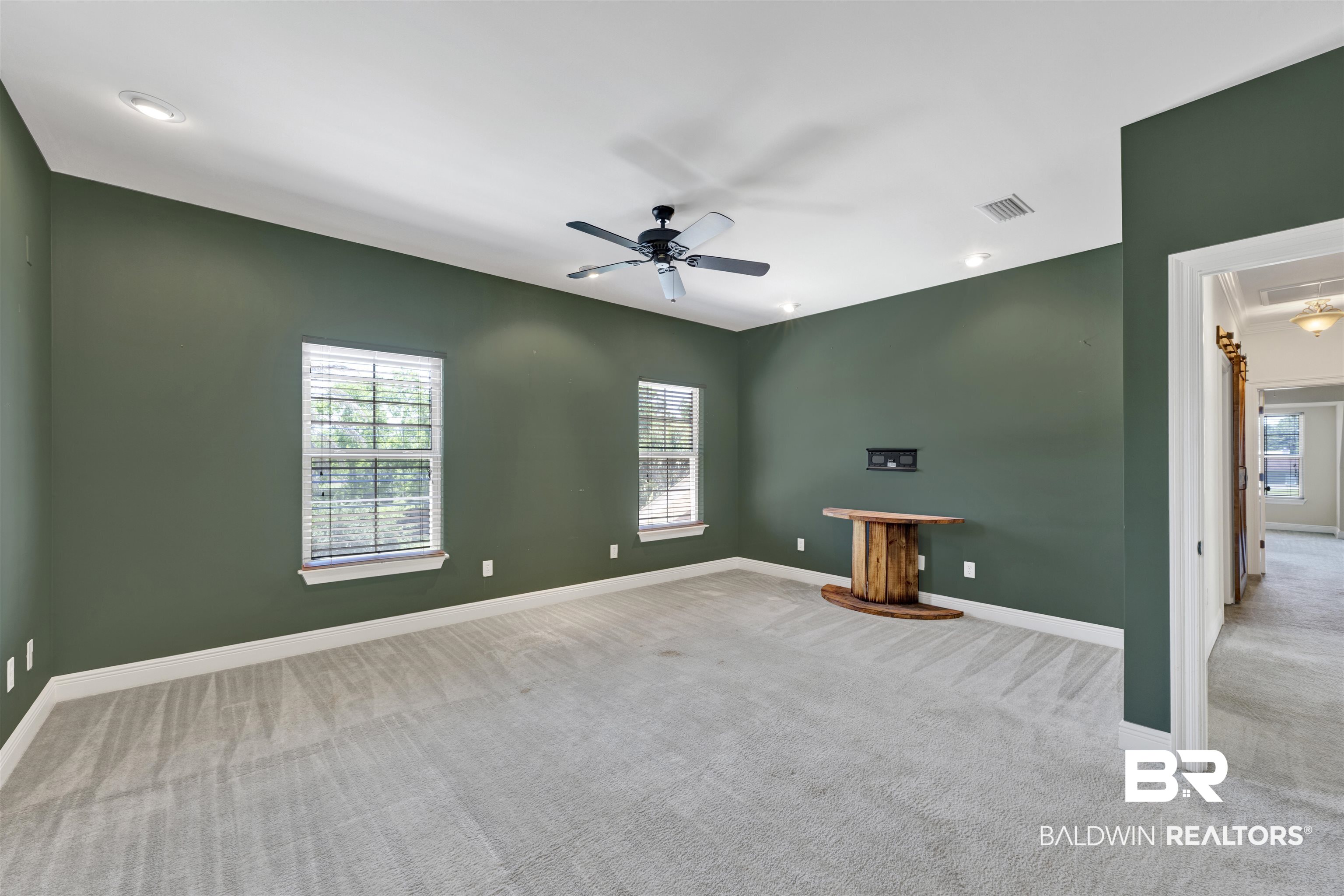 12944 Anna's Way Stapleton, AL 36578 - Photo 60 of 64 Expansive room featuring recessed lighting, a ceiling fan, and two windows with blinds