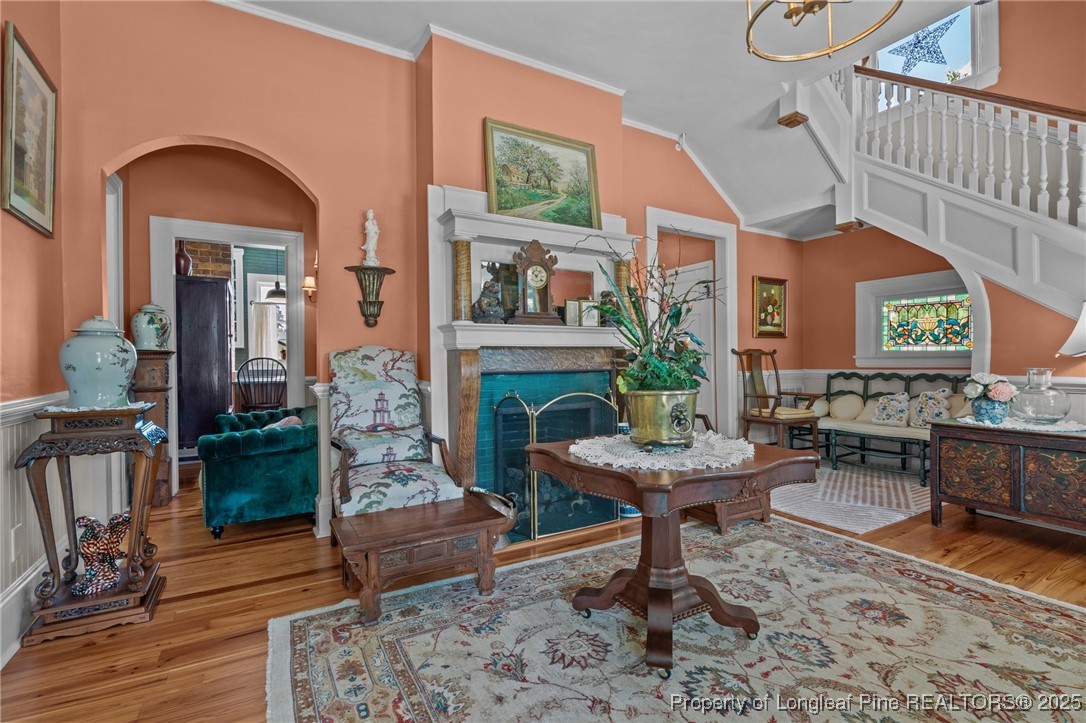 300 High Street Aberdeen, NC 28315 - Photo 14 of 50 a living room with furniture a fireplace and a large window with wooden floor