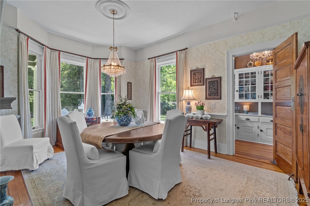 300 High Street Aberdeen, NC 28315 - Photo 21 of 50 a dining room with furniture a chandelier and window