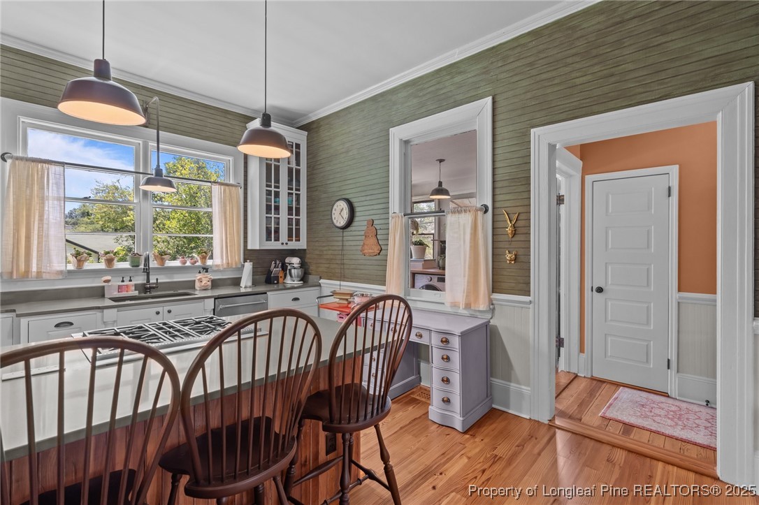 300 High Street Aberdeen, NC 28315 - Photo 22 of 50 a view of a dining room with furniture window and wooden floor