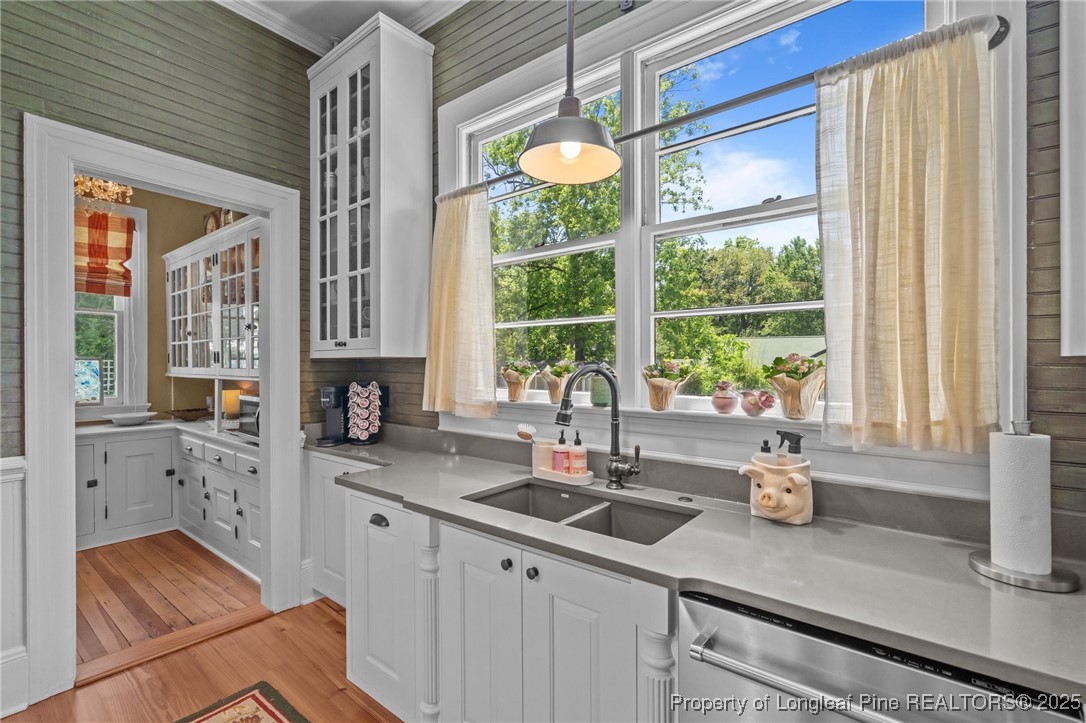 300 High Street Aberdeen, NC 28315 - Photo 24 of 50 a kitchen with sink a window and cabinets