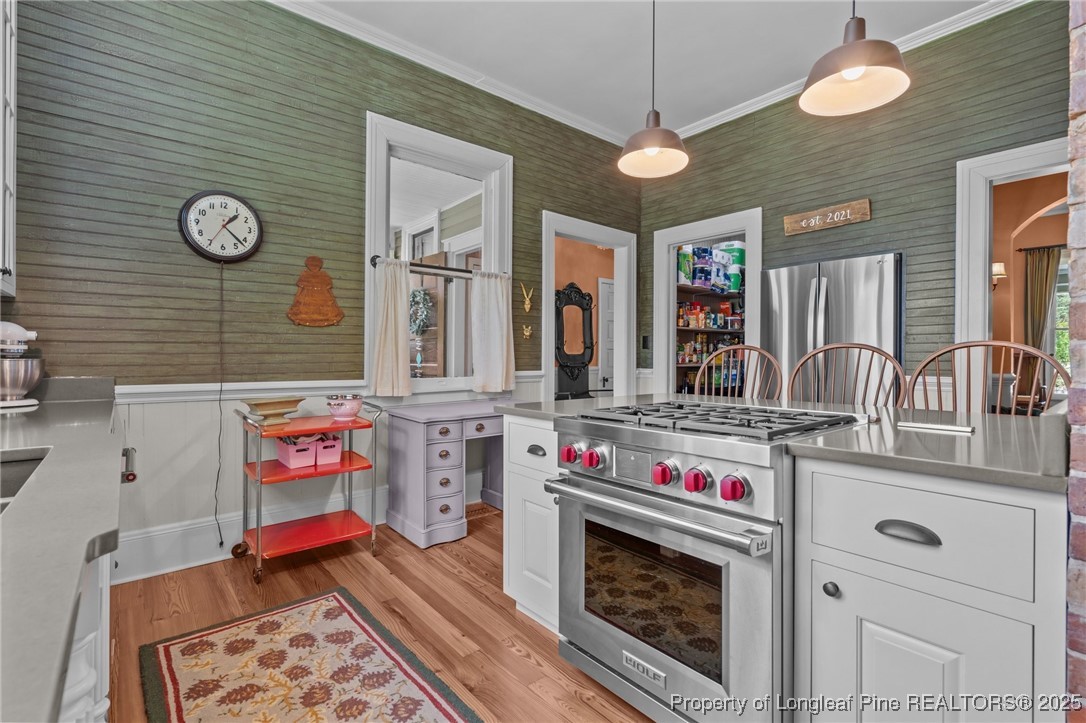 300 High Street Aberdeen, NC 28315 - Photo 25 of 50 a kitchen with stainless steel appliances granite countertop a stove and cabinets