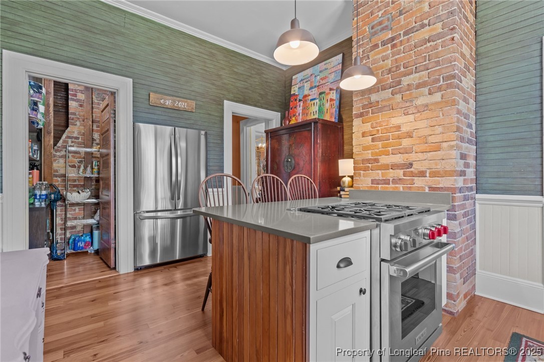 300 High Street Aberdeen, NC 28315 - Photo 26 of 50 a kitchen with stainless steel appliances granite countertop a stove and a refrigerator