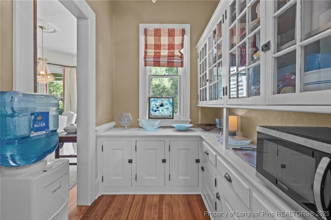 300 High Street Aberdeen, NC 28315 - Photo 27 of 50 a kitchen with a sink dishwasher a stove and a microwave oven
