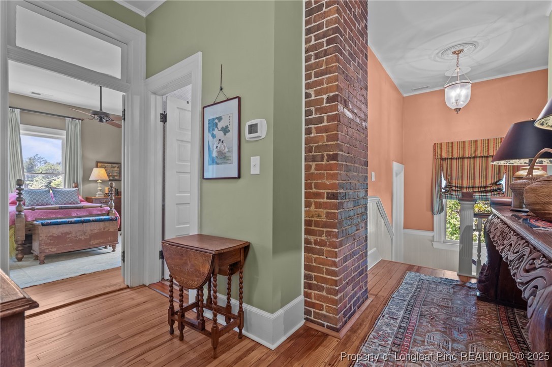 300 High Street Aberdeen, NC 28315 - Photo 35 of 50 a view of a hallway with wooden floor and a livingroom