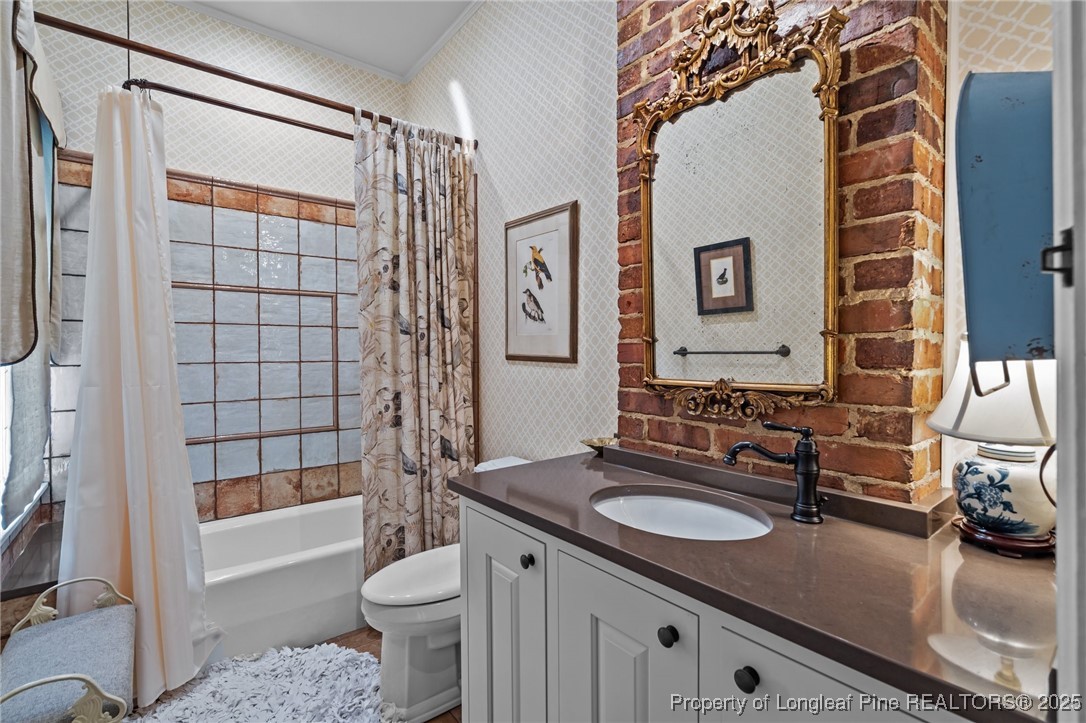 300 High Street Aberdeen, NC 28315 - Photo 36 of 50 a bathroom with a sink a toilet and shower