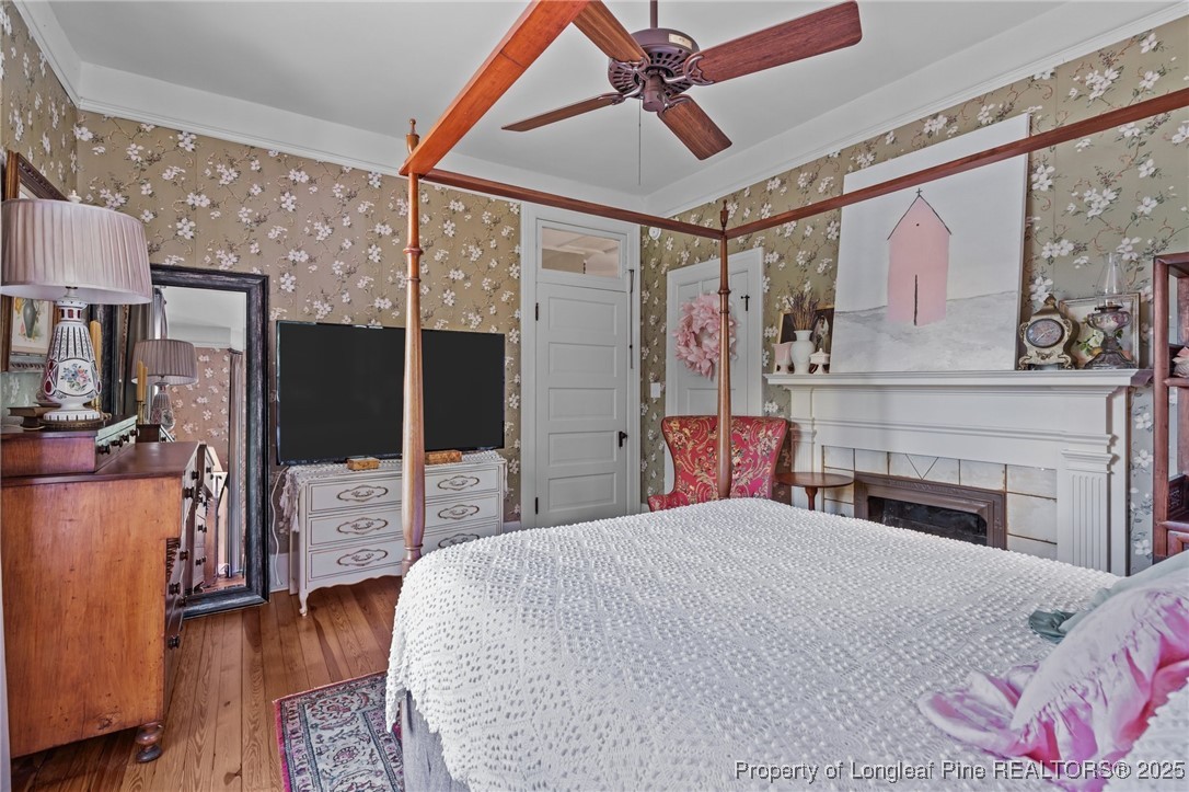 300 High Street Aberdeen, NC 28315 - Photo 40 of 50 a bedroom with a bed and a flat screen tv