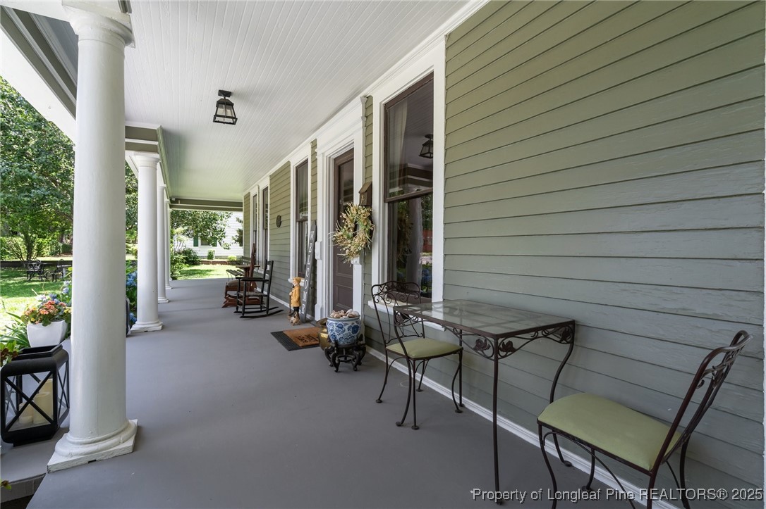 300 High Street Aberdeen, NC 28315 - Photo 45 of 50 a view of a patio with chairs and table in a patio