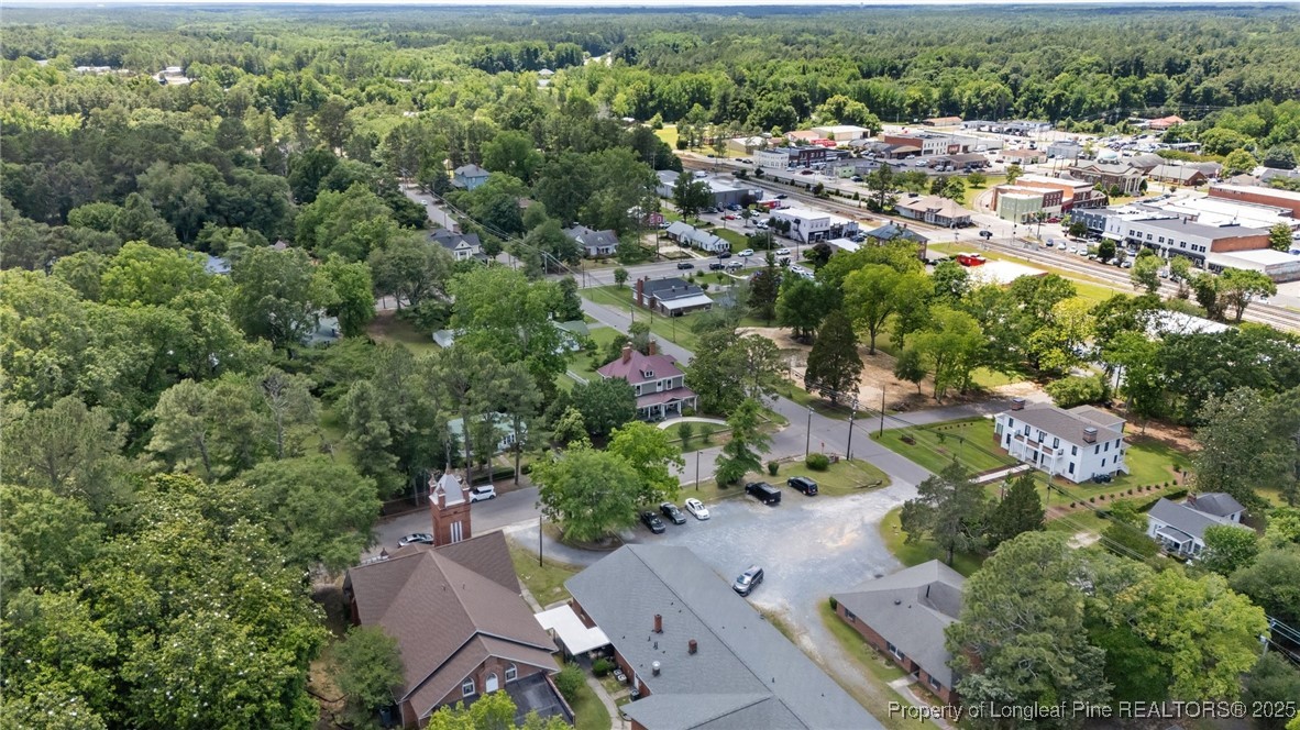 300 High Street Aberdeen, NC 28315 - Photo 5 of 50 an aerial view of residential house with outdoor space and trees all around