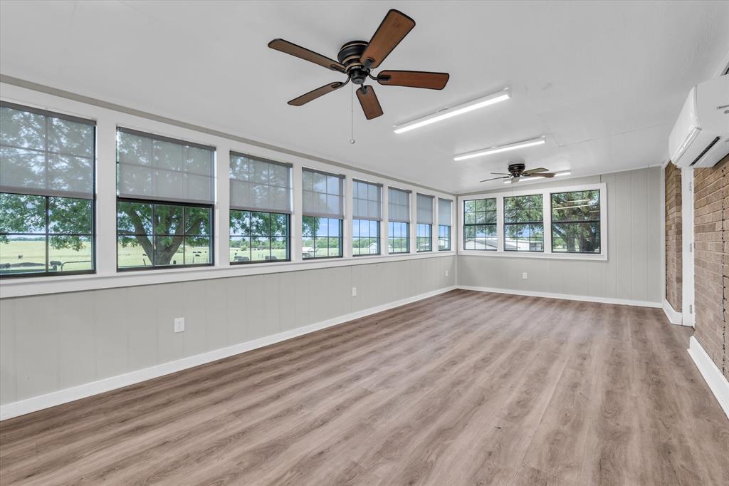 15796 Chapel Road Lorena, TX 76655 - Photo 16 of 28 a view of an empty room with wooden floor and a window