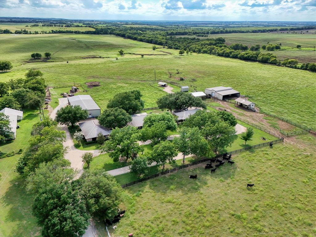 15796 Chapel Road Lorena, TX 76655 - Photo 4 of 28 an aerial view of ocean with residential house lake and green space