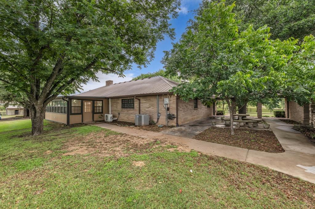 15796 Chapel Road Lorena, TX 76655 - Photo 7 of 28 a front view of a house with a garden