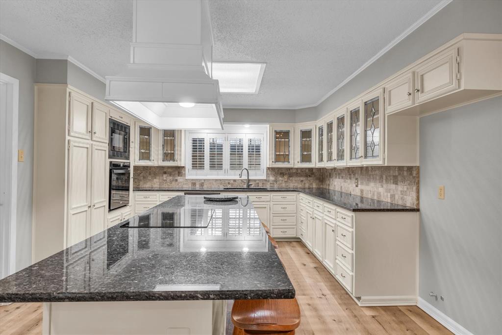 15796 Chapel Road Lorena, TX 76655 - Photo 10 of 28 a kitchen with stainless steel appliances granite countertop a sink and a white cabinets