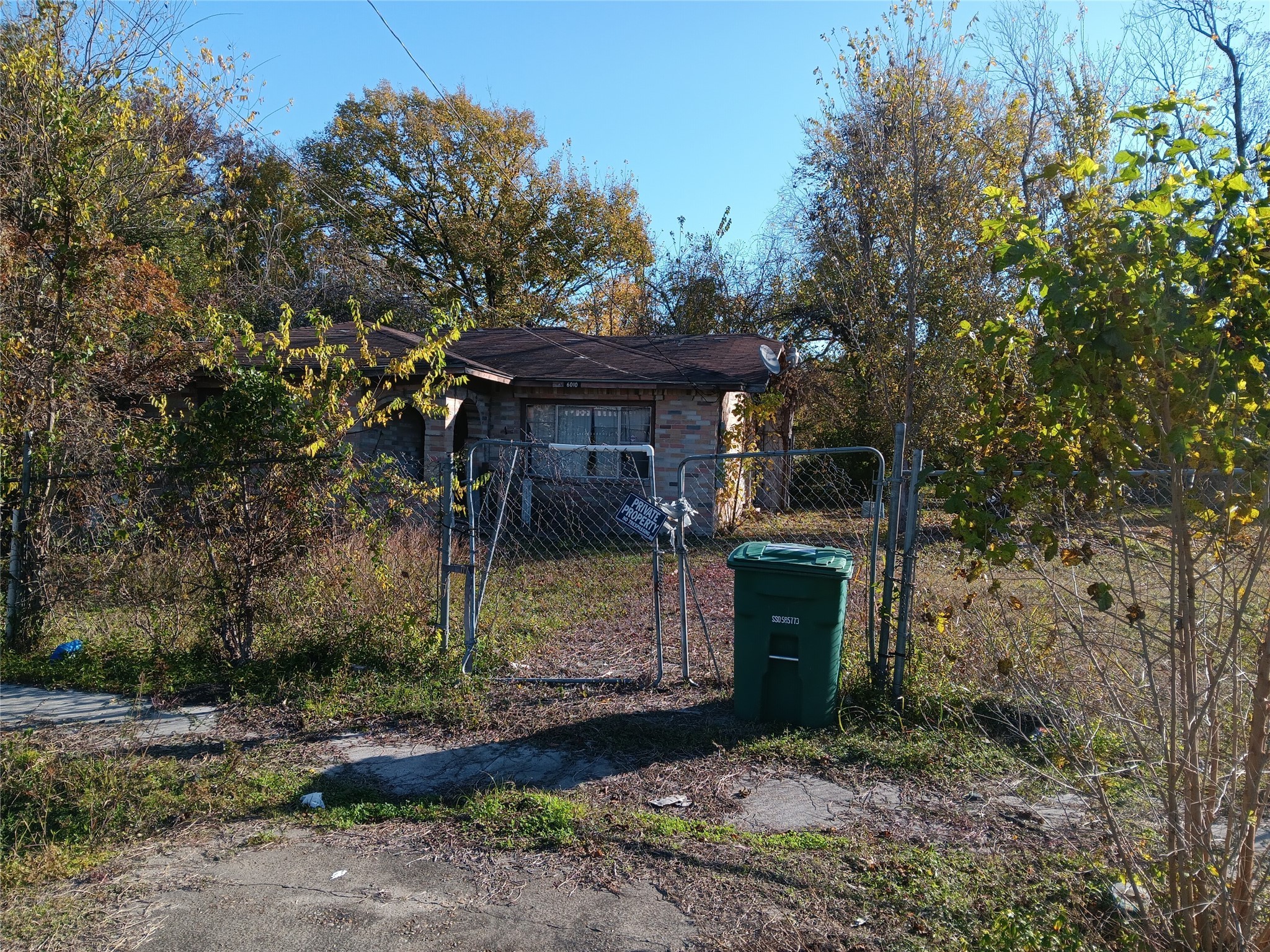 6010 Haight Street Houston, TX 77028 - Photo 2 of 4 a view of a wooden house with large trees