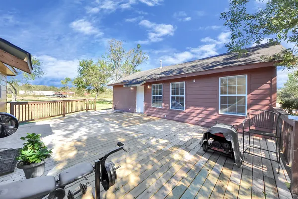 a view of backyard with patio