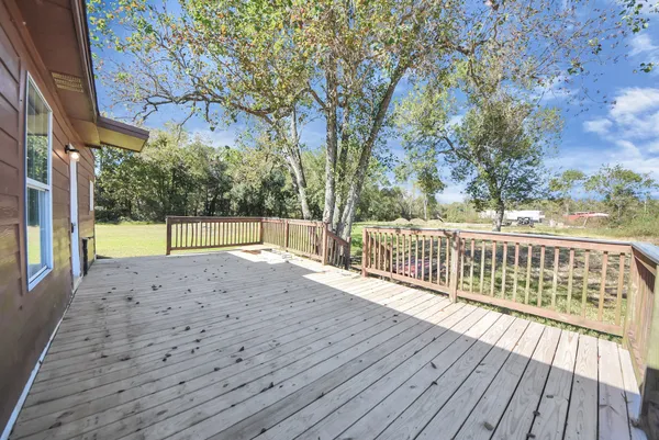 a view of balcony with wooden floor
