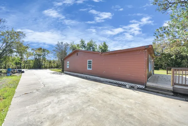 a backyard of a house with lots of green space