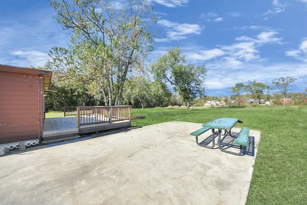 a view of a park with iron fence