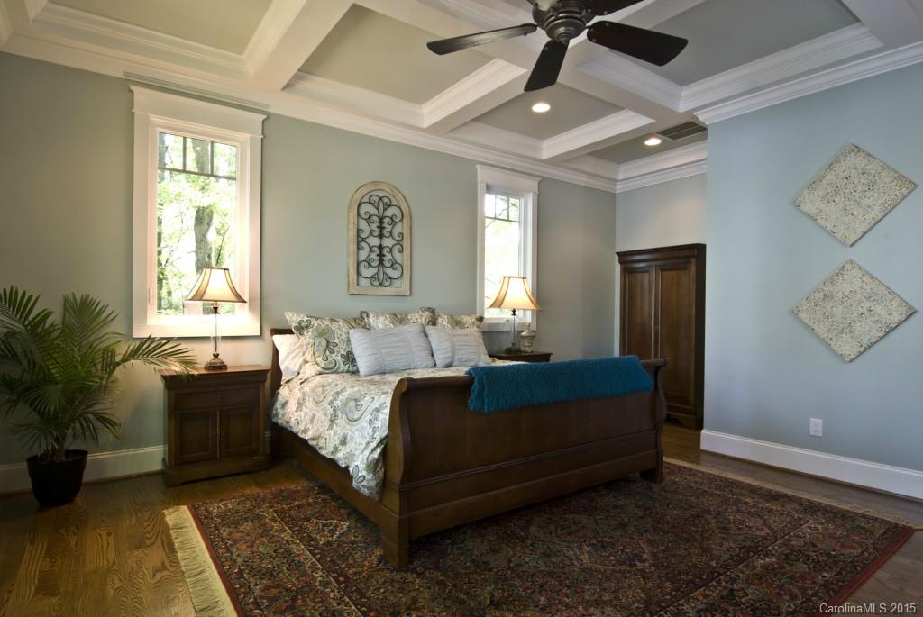 3320 Lake Shore Road South Denver, NC 28037 - Photo 12 of 21 a bed sitting in a spacious bedroom next to a window and a chandelier