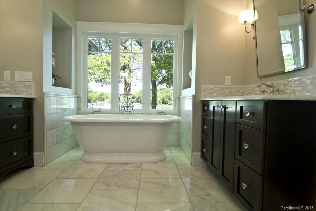 3320 Lake Shore Road South Denver, NC 28037 - Photo 13 of 21 a white bath tub sitting in a bathroom next to a window