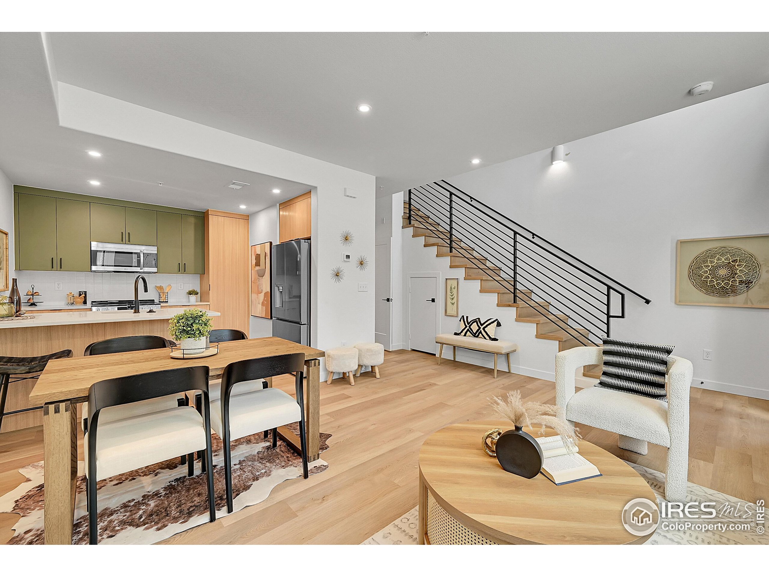 777 East County Line Road Erie, CO 80516 - Photo 2 of 15 a living room with furniture and a painting