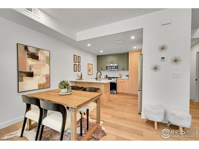 a open kitchen with dining table and chairs