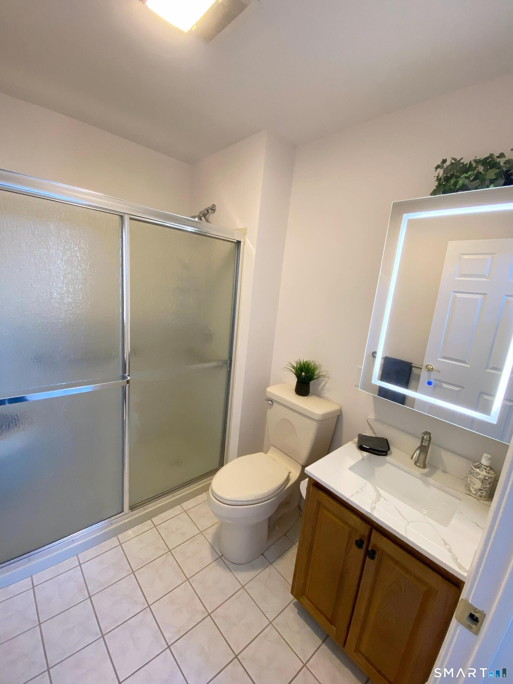 8 St George Place, Unit 8 Newtown, CT 06482 - Photo 11 of 31 Walk-in shower, Anti-Fog medicine cabinet with LED lighting, Handheld and rain shower heads