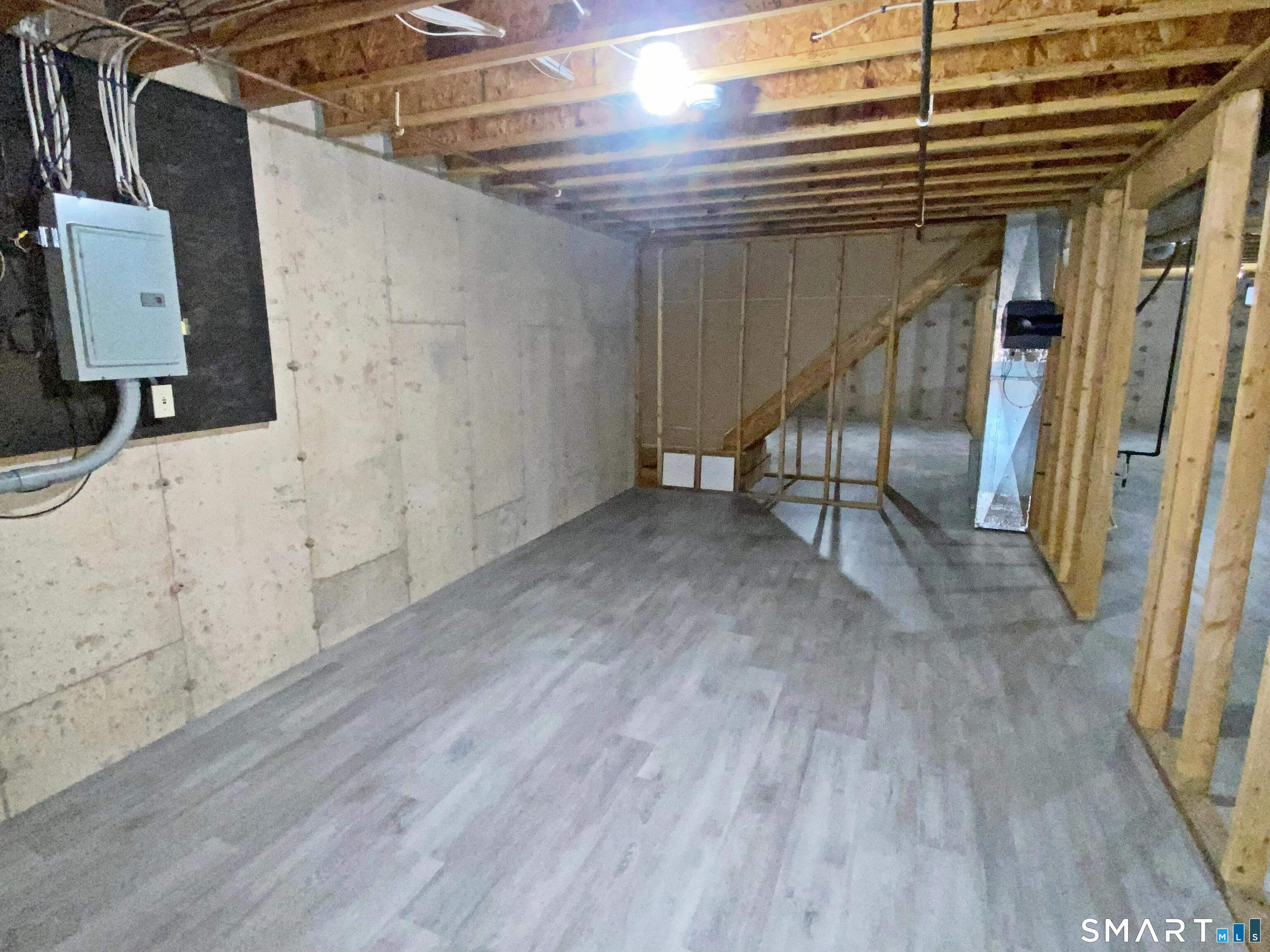 8 St George Place, Unit 8 Newtown, CT 06482 - Photo 20 of 31 Full basement with new laminate flooring